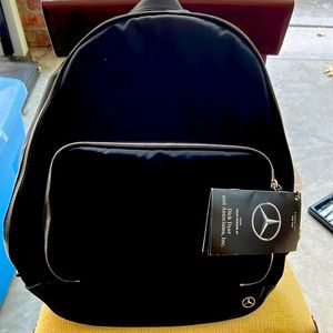 Mercedes Haerfest Black Bookbag With Gift Tag.